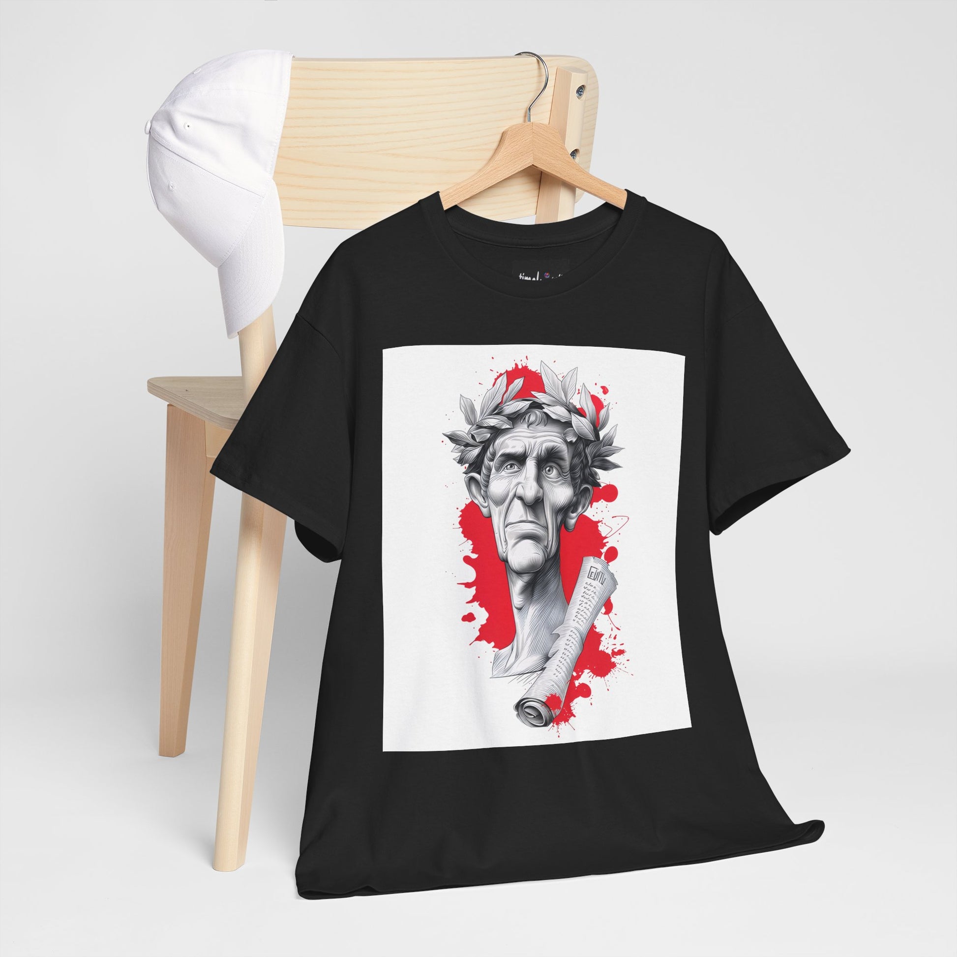 Black t-shirt with graphic design on a wooden chair