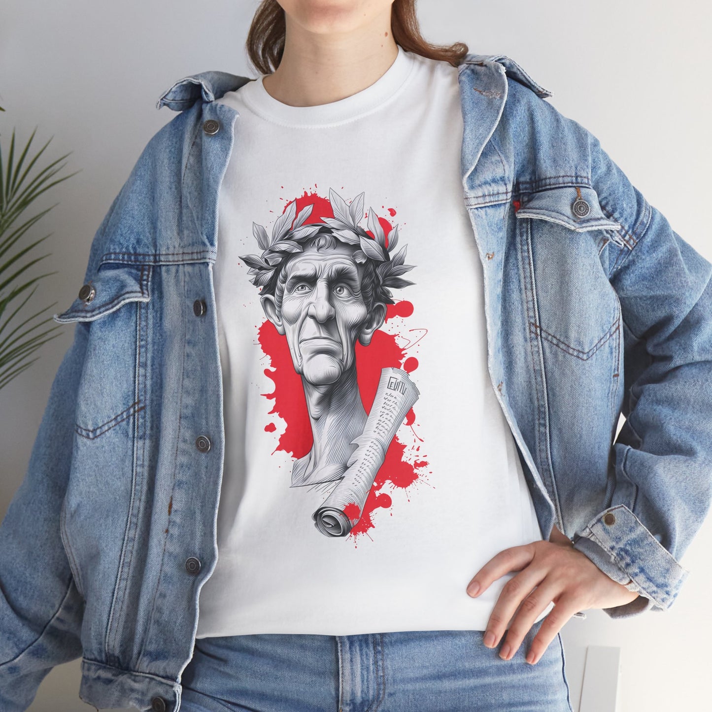 Person wearing a white t-shirt with a graphic design of a classical bust and laurel wreath, paired with a denim jacket.
