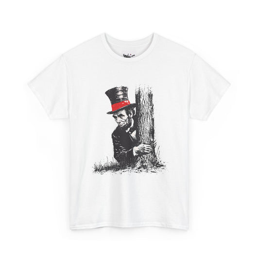 White t-shirt with a graphic of a person in a top hat hiding behind a tree on a white background